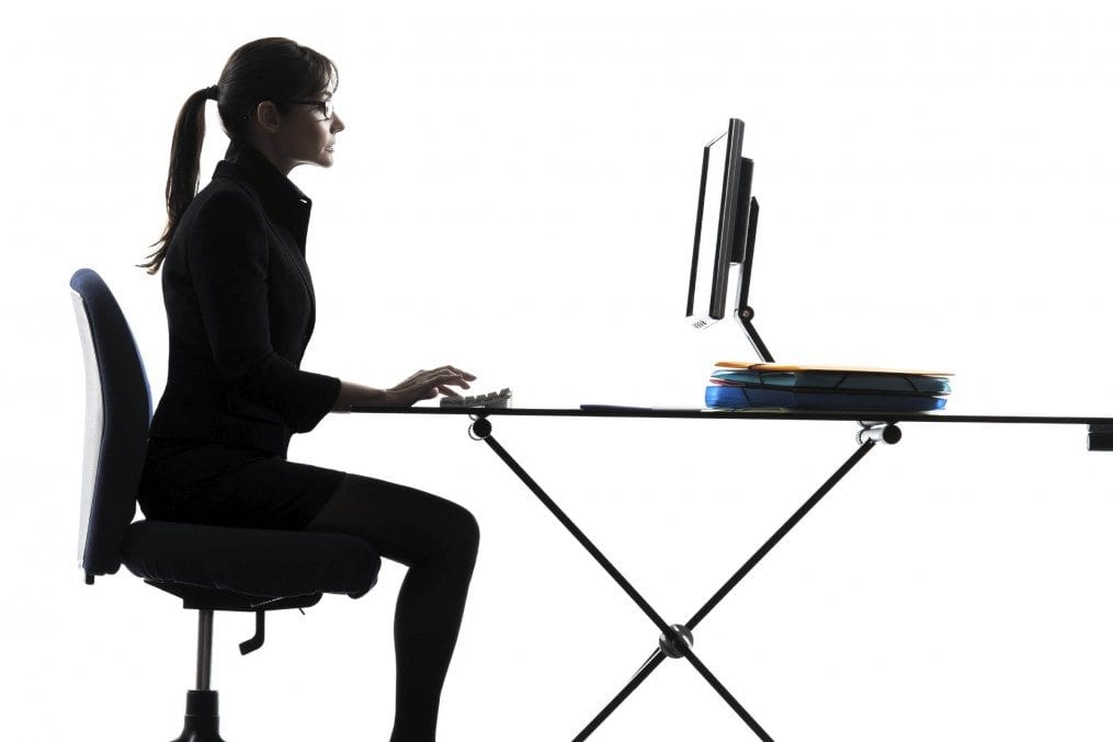 Woman working on computer at desk