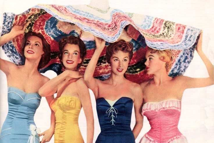 four women under a sheet