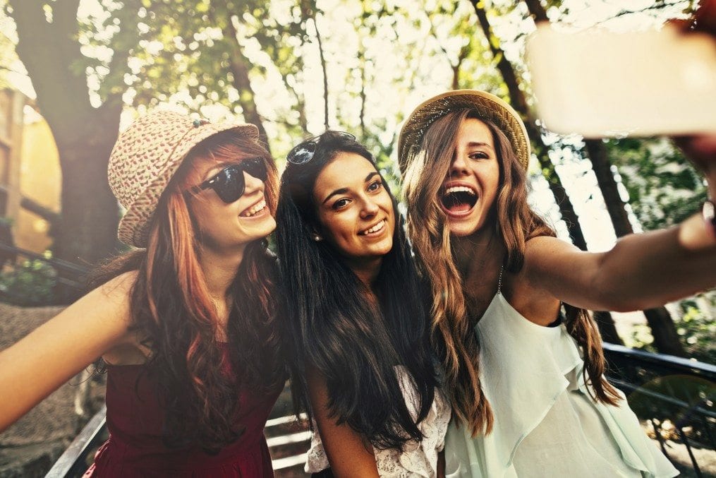 three young women taking a selfie