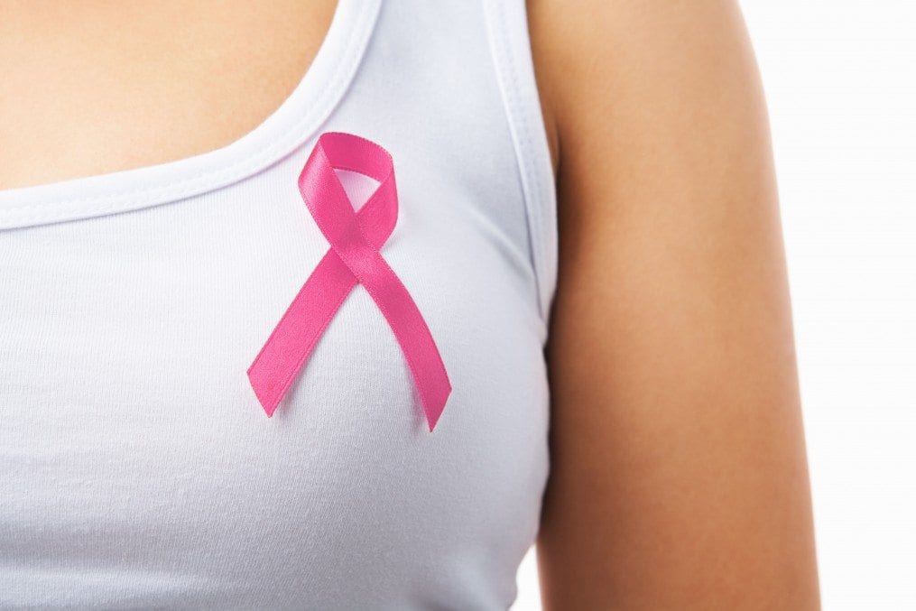 woman wearing cancer awareness ribbon