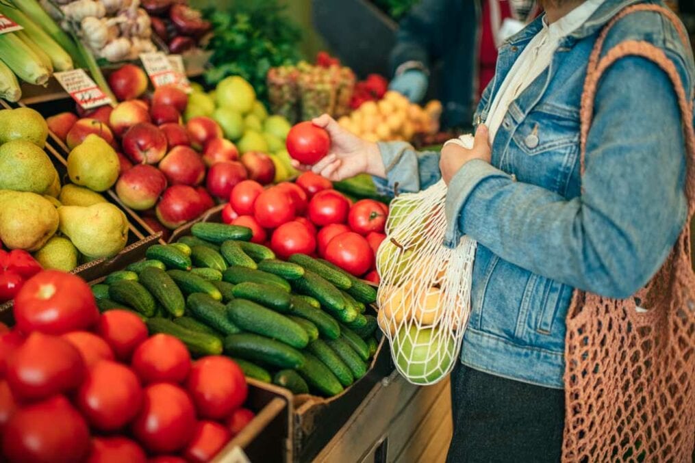 A woman buying fruit and vegetables