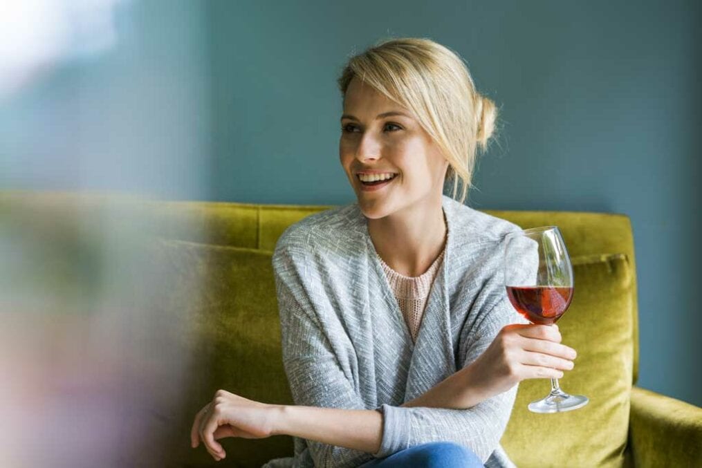 Woman holding a glass of red wine
