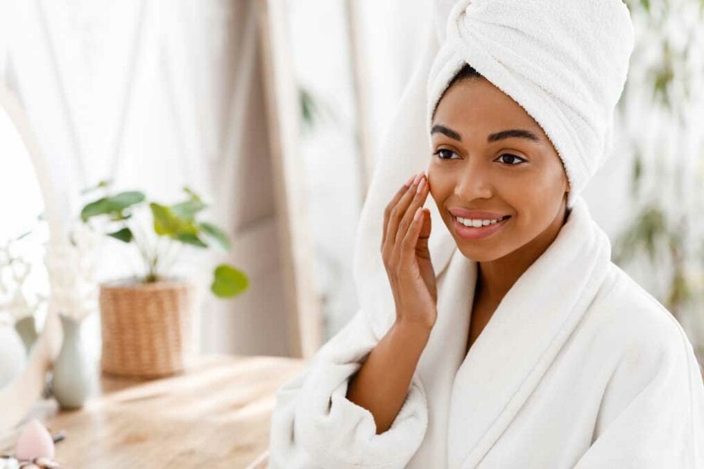 Woman applying face cream