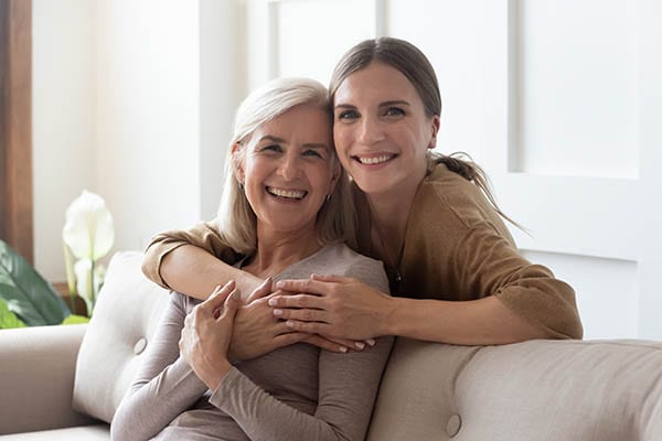 Loving daughter hugging mother