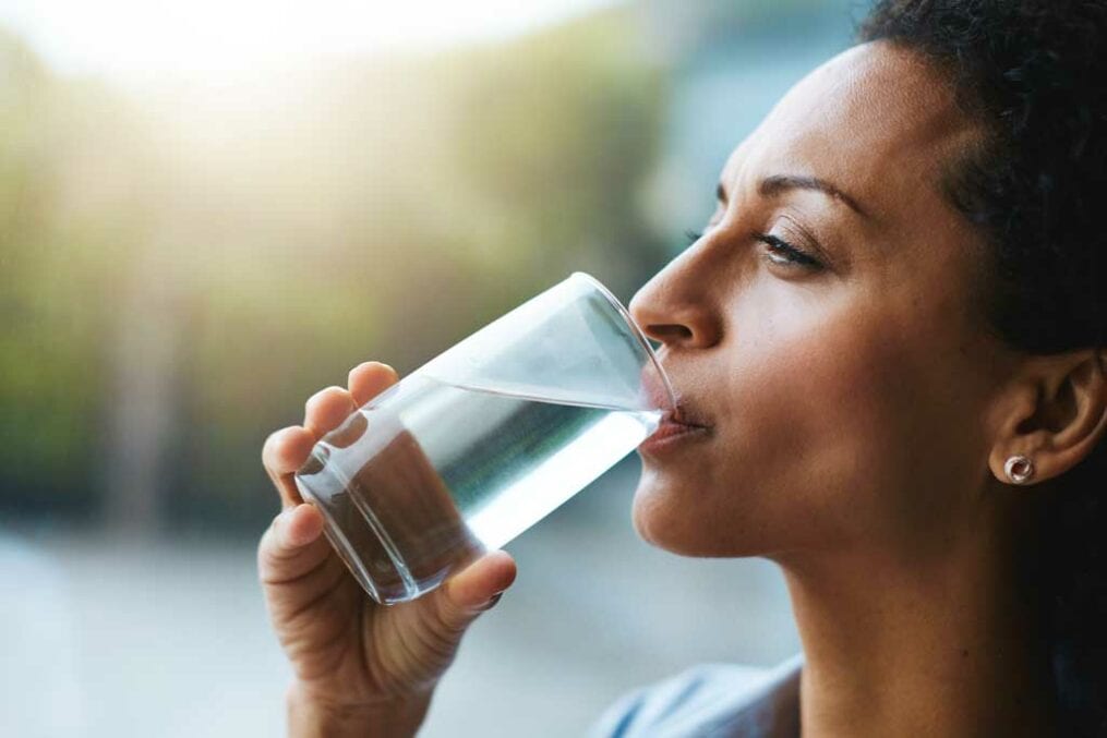 woman drinking glass of water